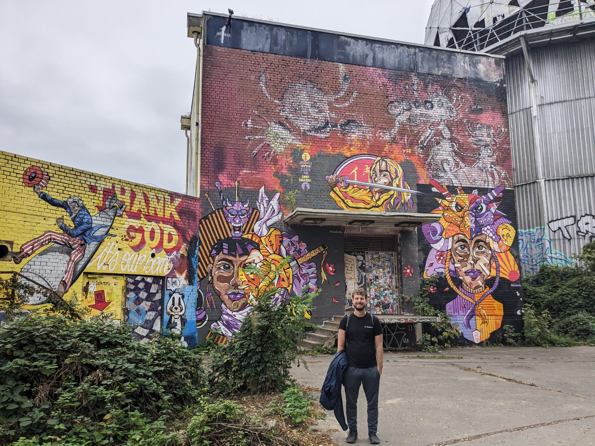 Berlin has so much cool graffiti, Tyler loves to stand in front of it.