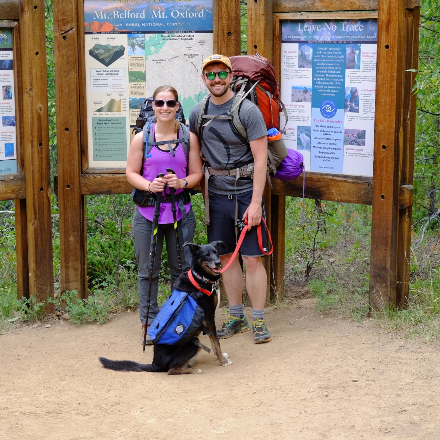 Randi, Andrew, and Marley at the trailhead bags packed!