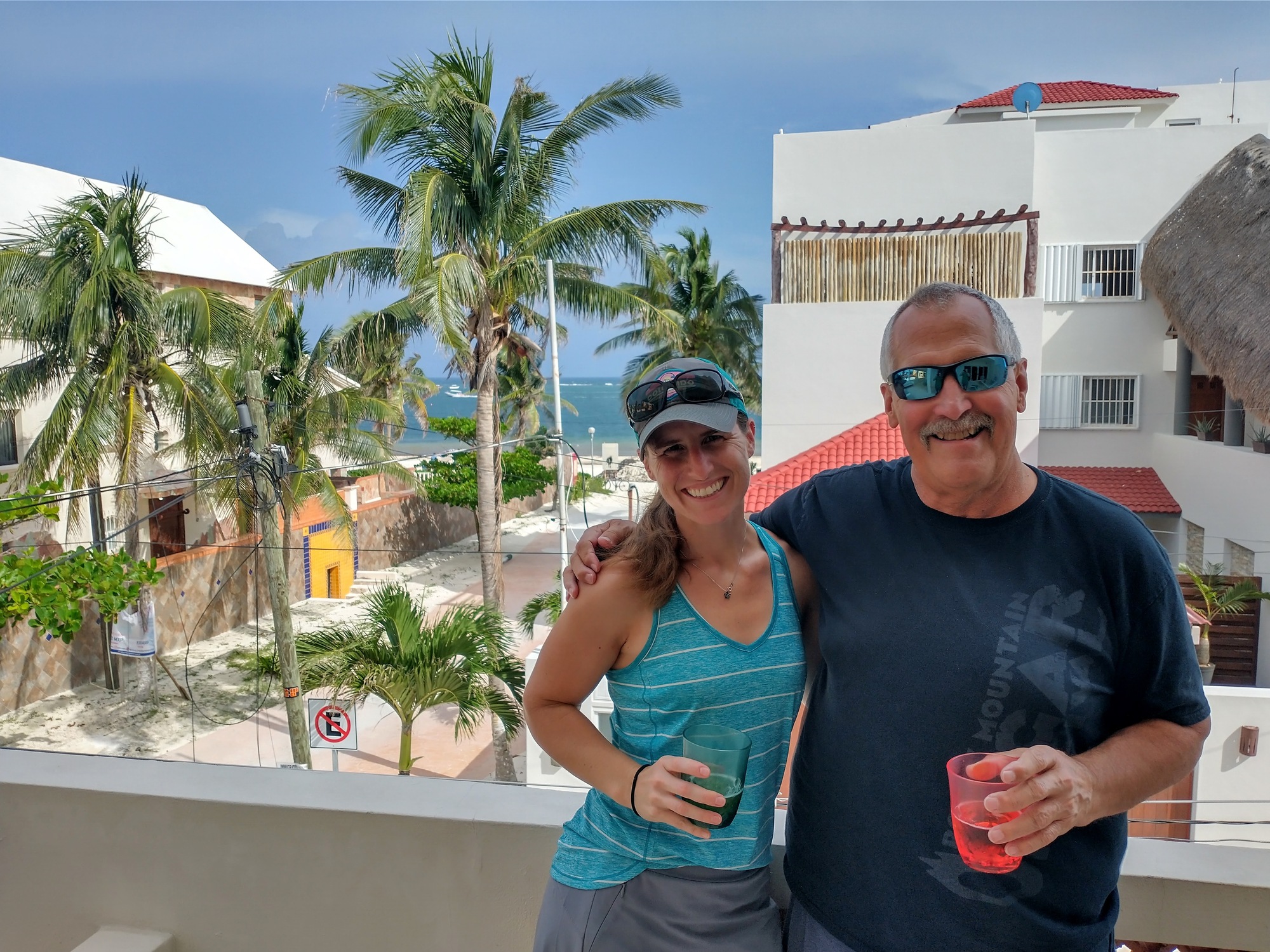 Randi and her dad out on the balcony enjoying the beach view.