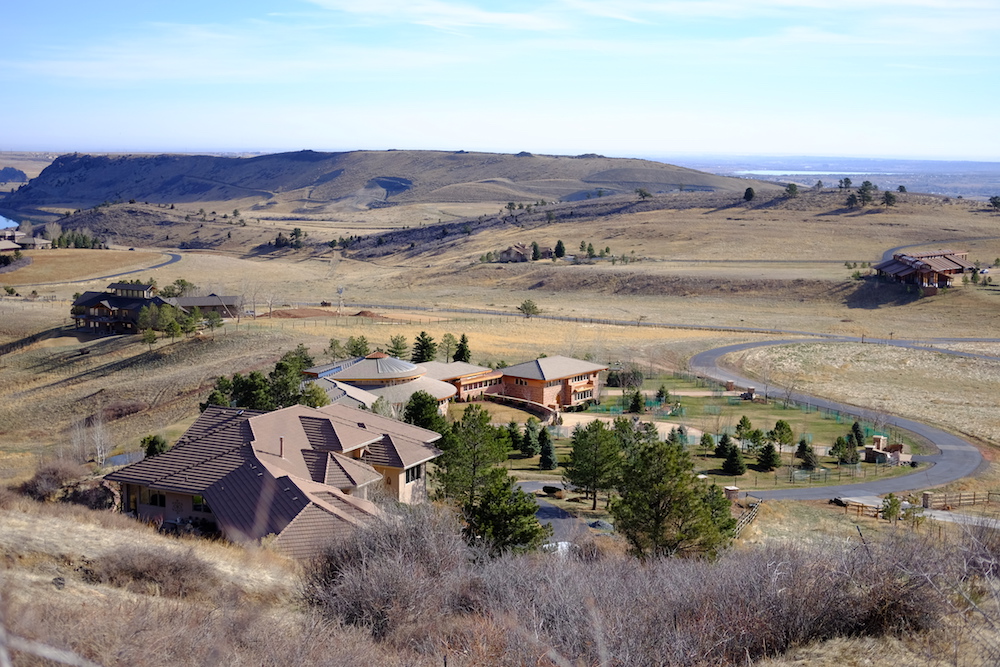 Massive houses with fancy roofs and lawns